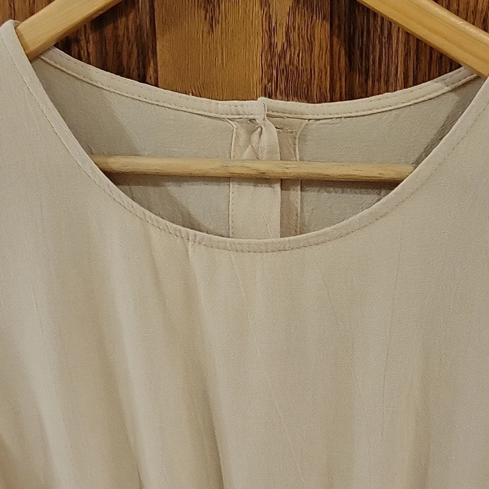 This is a womens linen jumpsuit in a tan color, size large. - Picture 2 of 4